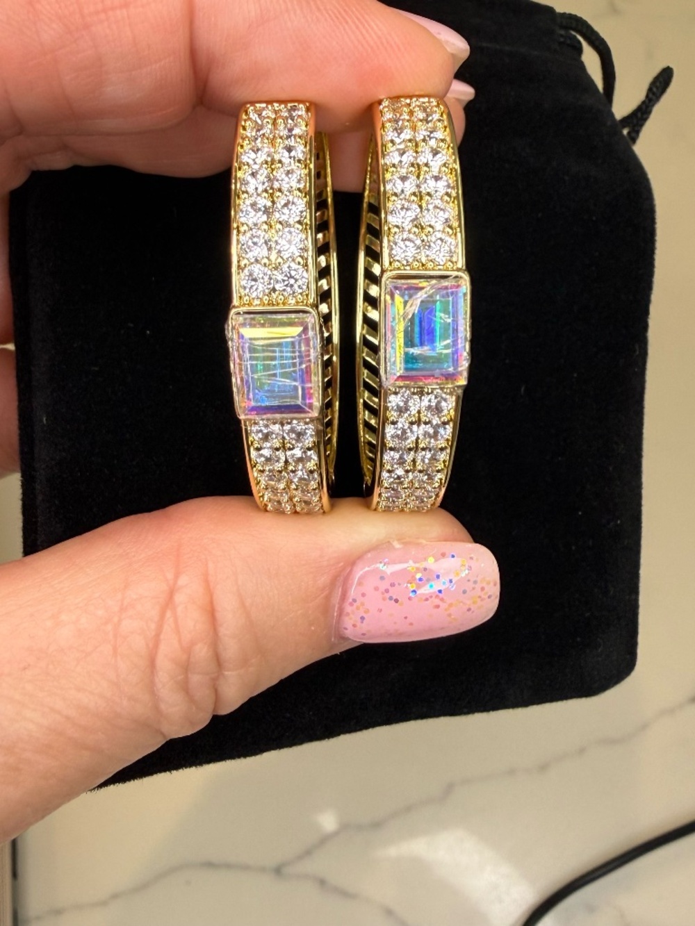 Gold hoops earrings, large size hoop with an iridescent emerald cut gemstone